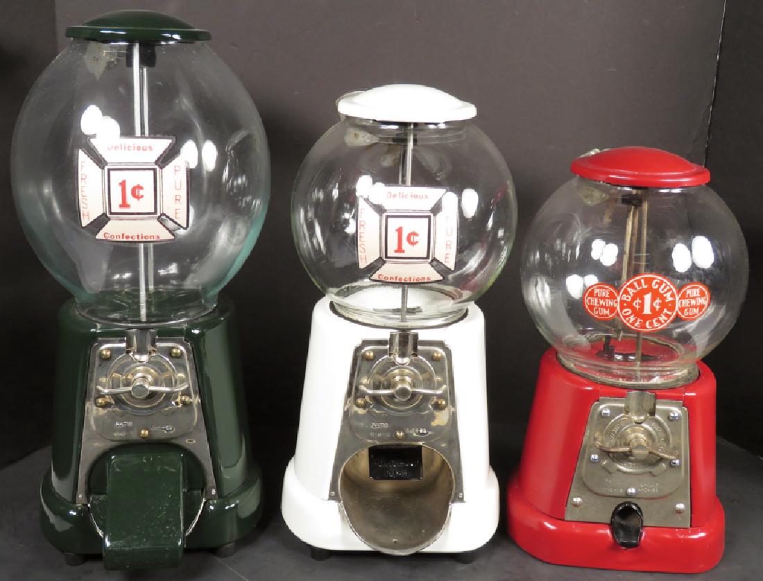 Collection of One Cent Vending Machines: Collection of One Cent Vending Machines. Advance Machine Co. Red, green and whitE All in very good working condition, come with keys. Tallest measures 16 1/2 inches.