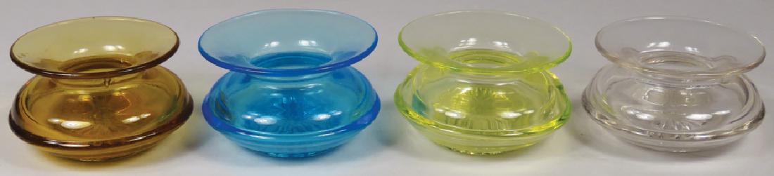 Four Antique Ladies Hand Held Spittoons: Four Antique Ladies Hand Held Spittoons. Pressed glass clear, vaseline, amber and aquA 2 3/4 X 1 3/4 inches. No chips or cracks.