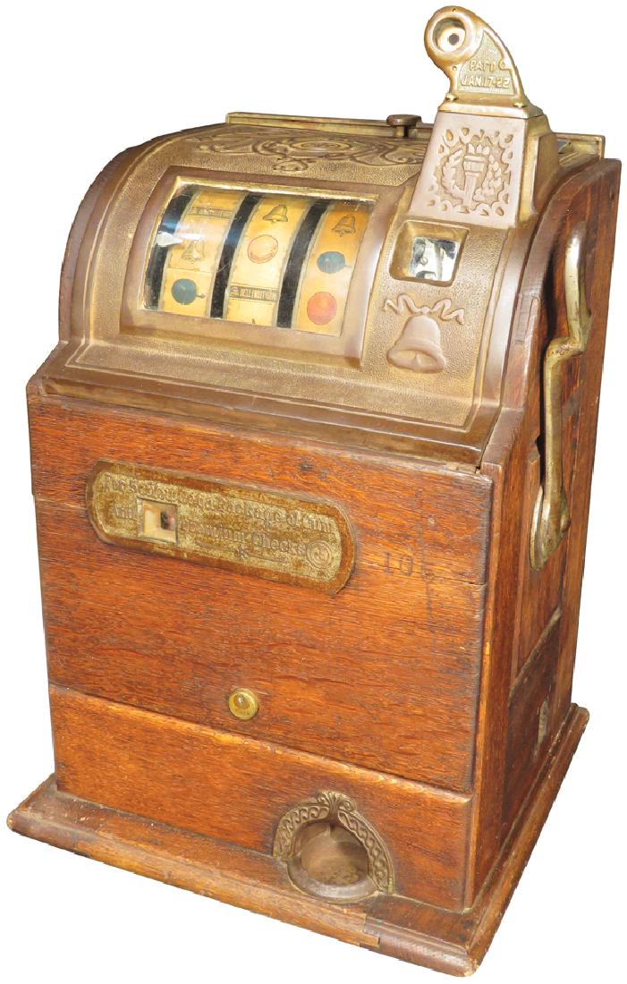 Jennings 5 Cent Slot Machine w/Oak Cabinet: Coin Operated Jennings 5 Cent Slot MachinE For 5 cents a package of gum and premium checks. Oak cabinet. Original working condition.