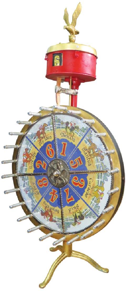 H.C Evans Co. Small Wheel of Fortune Game: Small Wheel of Fortune GamE H.C Evans Co. Chicago. Eagle finial. Odd maker on top. 43 inches tall X 20 1/2 inches.