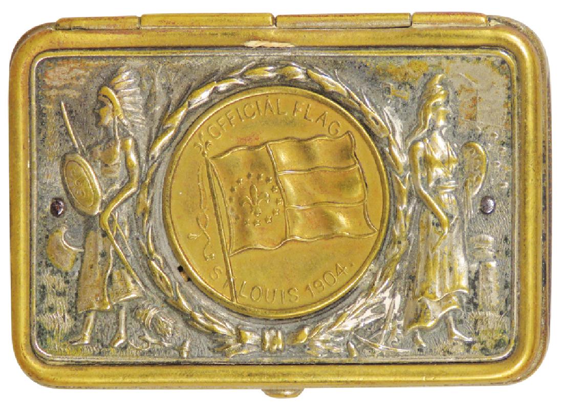 1904 St. Louis World's Fair Souvenir Pill Box: 1904 St. Louis World's Fair Souvenir Pill Box. Native American embossed motif. Nickel and brass, 4 small holes punched in bottom. 2 3/8 X 1 5/8 inches.