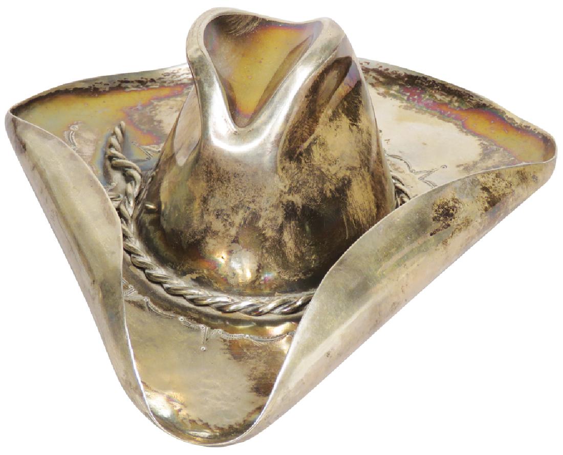 Sterling Silver Cowboy Hat Paperweight: Sterling Silver Cowboy Hat Paperweight. Stamped on back Vaughn's Sterling. This company made jewelry for the Hollywood elite in the 70's.