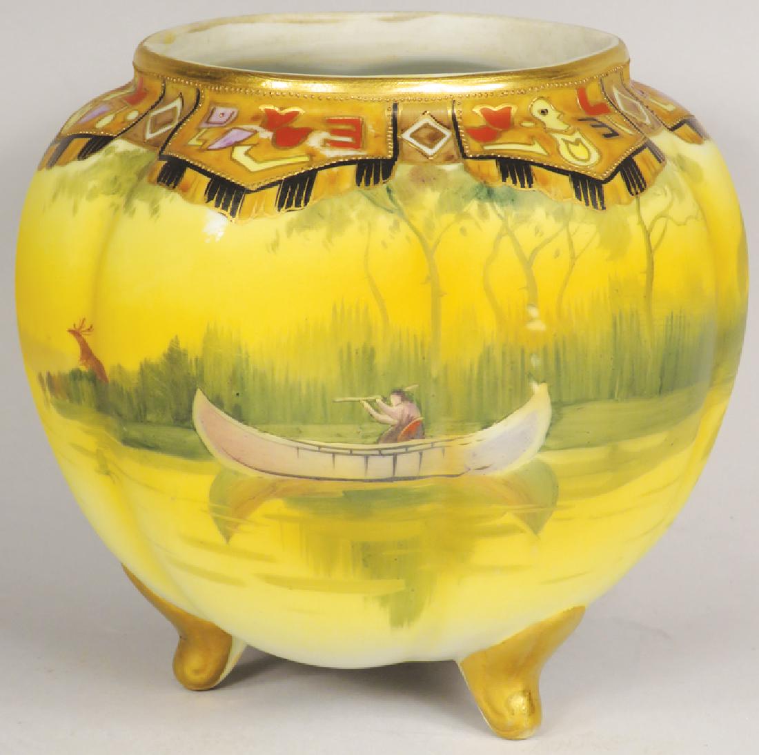 Nippon Hand Painted Porcelain Footed Bowl: Nippon Hand Painted Porcelain Footed Bowl. Native Indian in canoe motif. No chips or cracks. 6 1/2 inches tall X 6 1/2 inch diameter.
