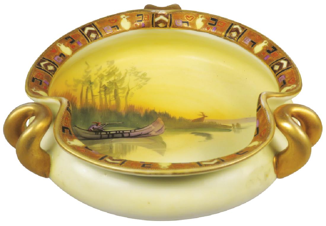 Nippon Hand Painted Porcelain Dish: Nippon Hand Painted Porcelain Dish. Pinched edges with handles. Native Indian in canoe motif. No chips or cracks. 7 1/2 inch diameter X 2 1/2 inches tall.