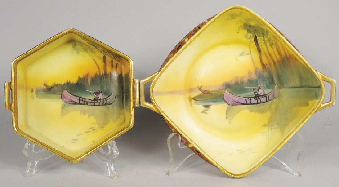 Two Nippon Hand Painted Porcelain Dishes: Two Nippon Hand Painted Porcelain Handled Dishes. Native Indian in canoe motif. No chips or cracks. Largest measures 8 X 7 X 2 inches.