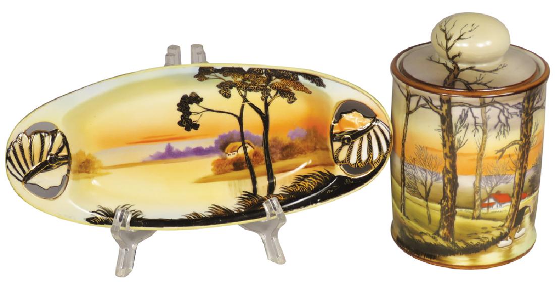 Noritake and Nippon Hand Painted Porcelain Items: Noritake and Nippon Hand Painted Porcelain Items. Noritake lidded jar with swan motif. Nippon tray with Indian Heads on handles and pastoral motif. No chips or cracks. Tray measures 8 3/8 X 3 3/4 X 1 