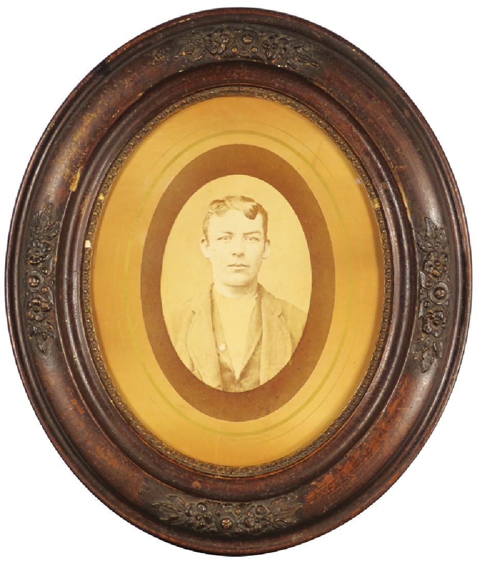 1885 Original Albumen Print Butch Cassidy Likeness: 1885 Original Albumen Print Butch Cassidy Likeness. Represents a strong resemblance of Butch as a young man. Purchased in New Castle, Wyoming. Mounted on oval hard stock in period frame. 4 X 5 1/2 inc
