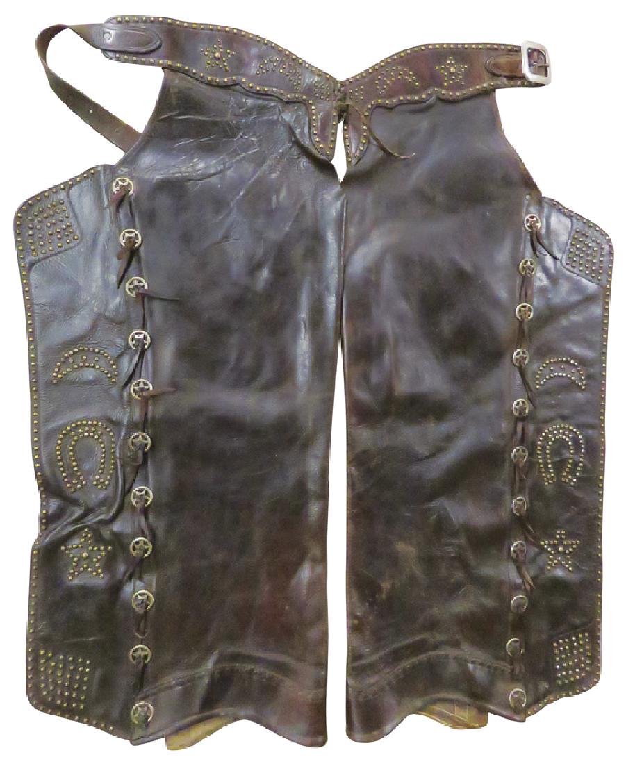 Batwing Leather Studded Chaps: Batwing Leather Studded Chaps. Stamped L-586. Studded with crescent moon, horseshoe and star. Good original condition.
