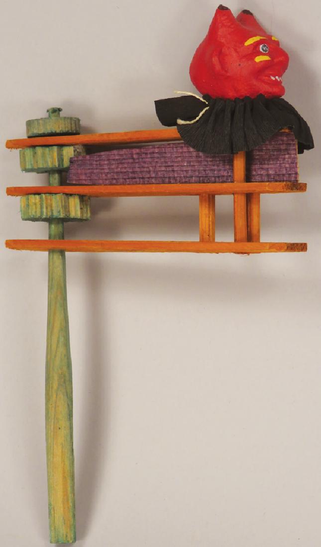 Two Vintage Halloween Wood Ratchet Noisemakers: Two Vintage German Halloween Wood Ratchet Noisemakers. Composition devil head with crepe paper trim. Cardboard pumpkin head with crepe paper trim. Both marked Germany, excellent overall condition.