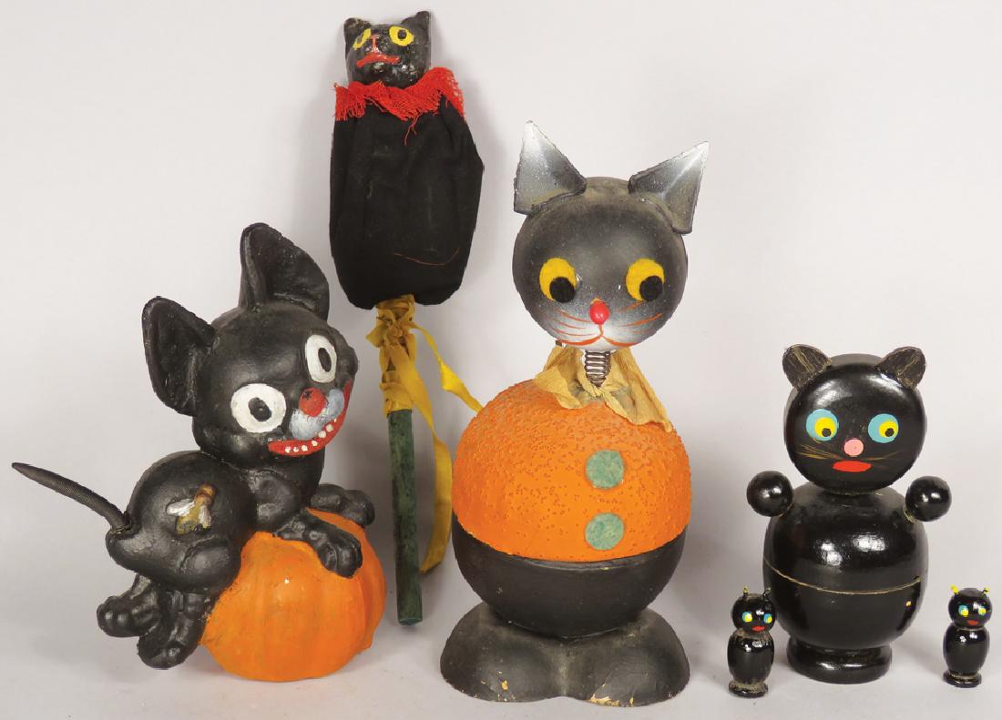 Collection of Vintage Black Cat Halloween Items: Collection of Vintage Black Cat Halloween Items. Three candy containers. Two tiny wood cats. Composition cat head squeaker noise maker.