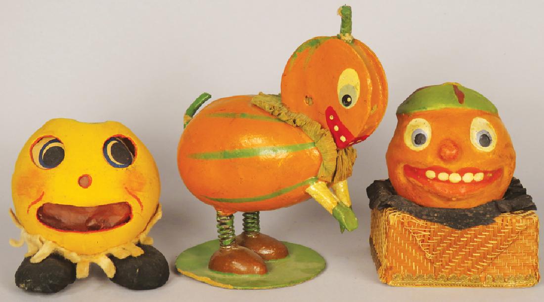 Collection of Vintage Halloween Items: Collection of Vintage Halloween Items. Veggie cardboard nodder. Two composite candy containers. Ca. 1920's-30's. Nodder measures 4 X 4 X 2 3/4 inches.