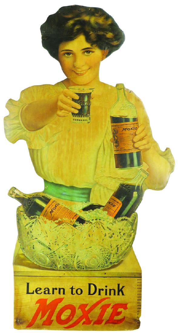 Moxie Die Cut Cardboard Store Display Sign: Moxie Die Cut Cardboard Store Display Sign. "Learn to Drink Moxie-Very Healthful", great graphics. Fair to good condition. Framed under glass in shadow box display. 22 1/2 X 37 inches.