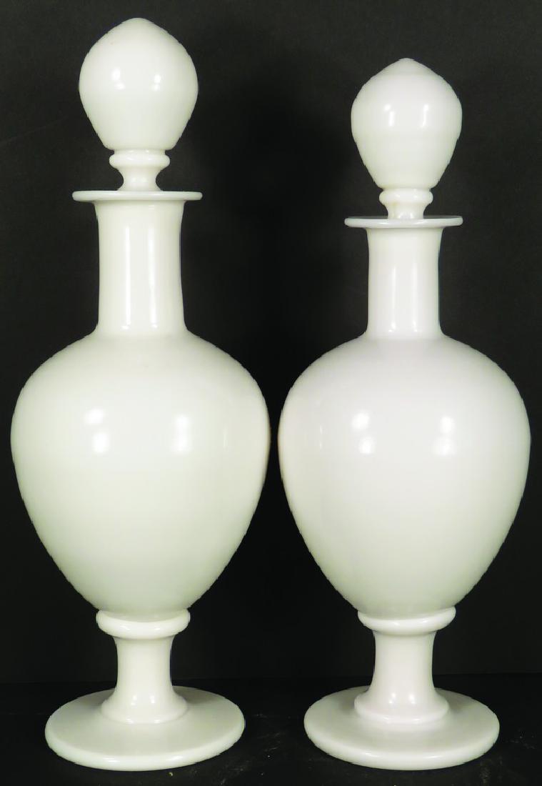 Pair of White Opaline Milk Glass Apothecary Jars: Pair of White Opaline Milk Glass Apothecary Jars. No chips or cracks. 14 3/4 & 15 1/2 inches tall.