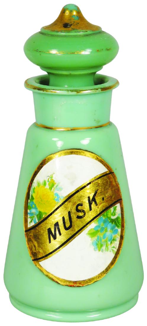 Musk Label Under Glass Barber Bottle: Musk Label Under Glass Barber Bottle. Green milk glass with original ground glass stopper. No chips or cracks. 7 inches tall. Tallest measures 8 1/4