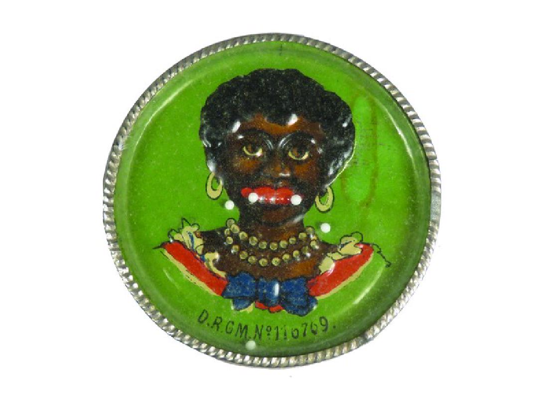 Tin Pocket Game Mirror: Tin Pocket Game Mirror. Embossed tin Black Americana Image with mirror on back. Marked D.R.G.M. No.110709. Good original condition. 2 1/2 inch diameter.