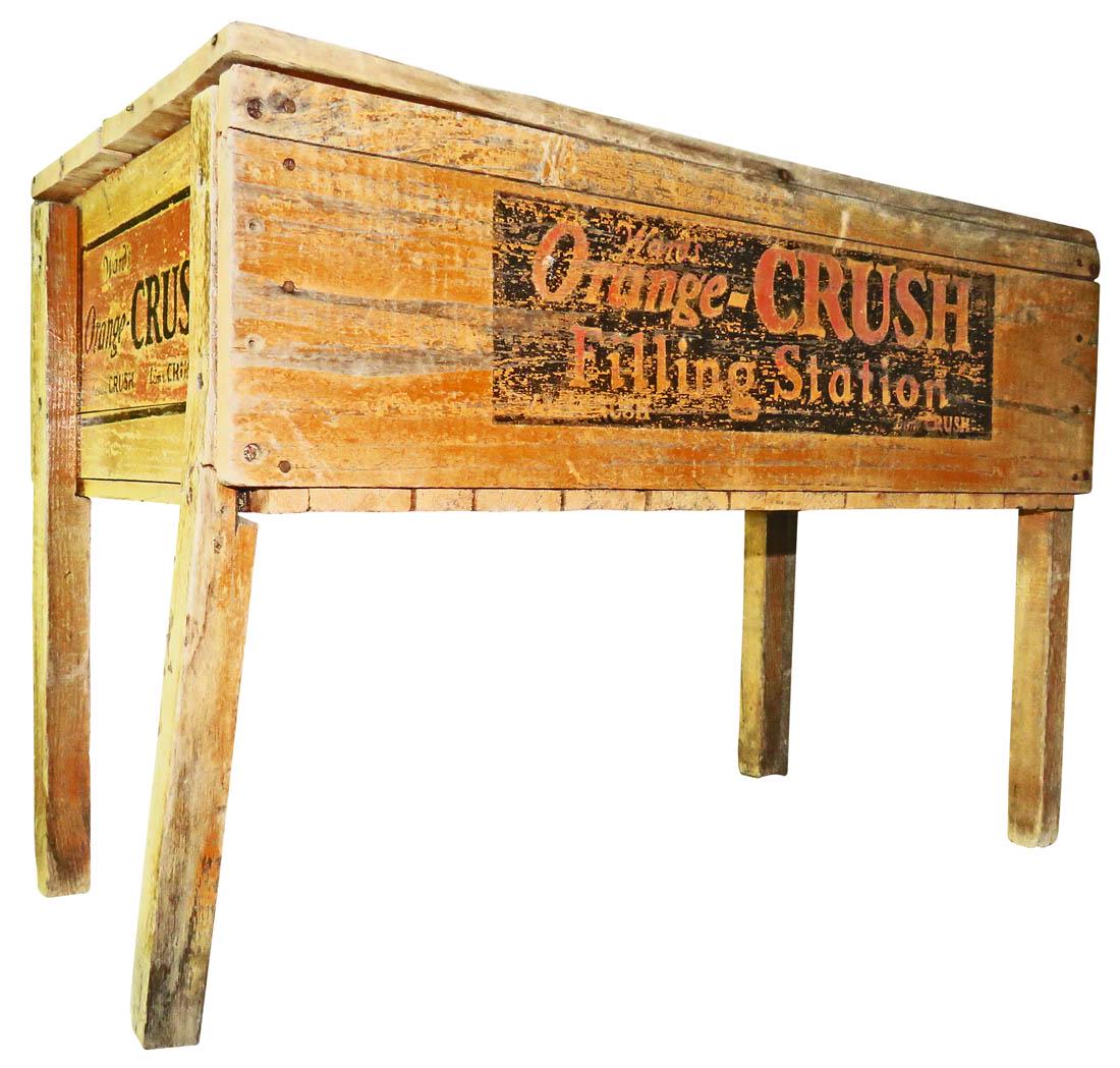 Ward's Orange Crush Gas Station Cooler: Ward's Orange Crush Gas Station Soda Cooler. Wood with metal lining. One leg broken and Outdoor wear. 38 1/2 X 26 X 19 3/4 inches.