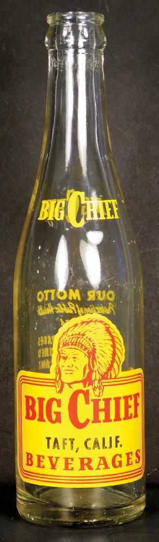 Coca Cola Big Chief Beverage Bottle: Coca Cola Big Chief Beverage Bottle, Taft, Calif. Enamel label, small chip bottom rim. 9 1/4 inches tall.