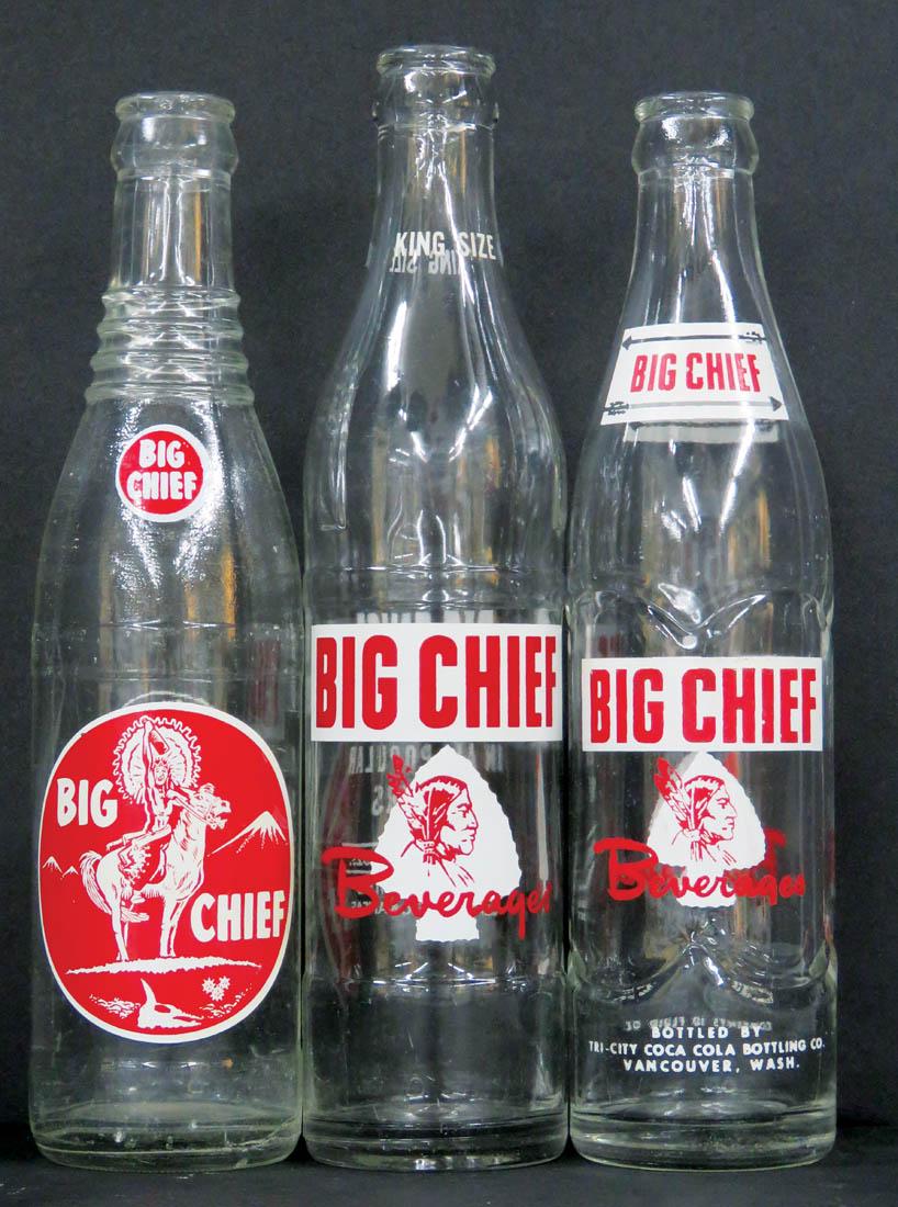 Three Coca Cola Big Chief Beverage Bottles: Three Coca Cola Big Chief Beverage Bottles. Enamel labels with braves and Indian on horse. No chips or cracks. 10 fluid ounces.