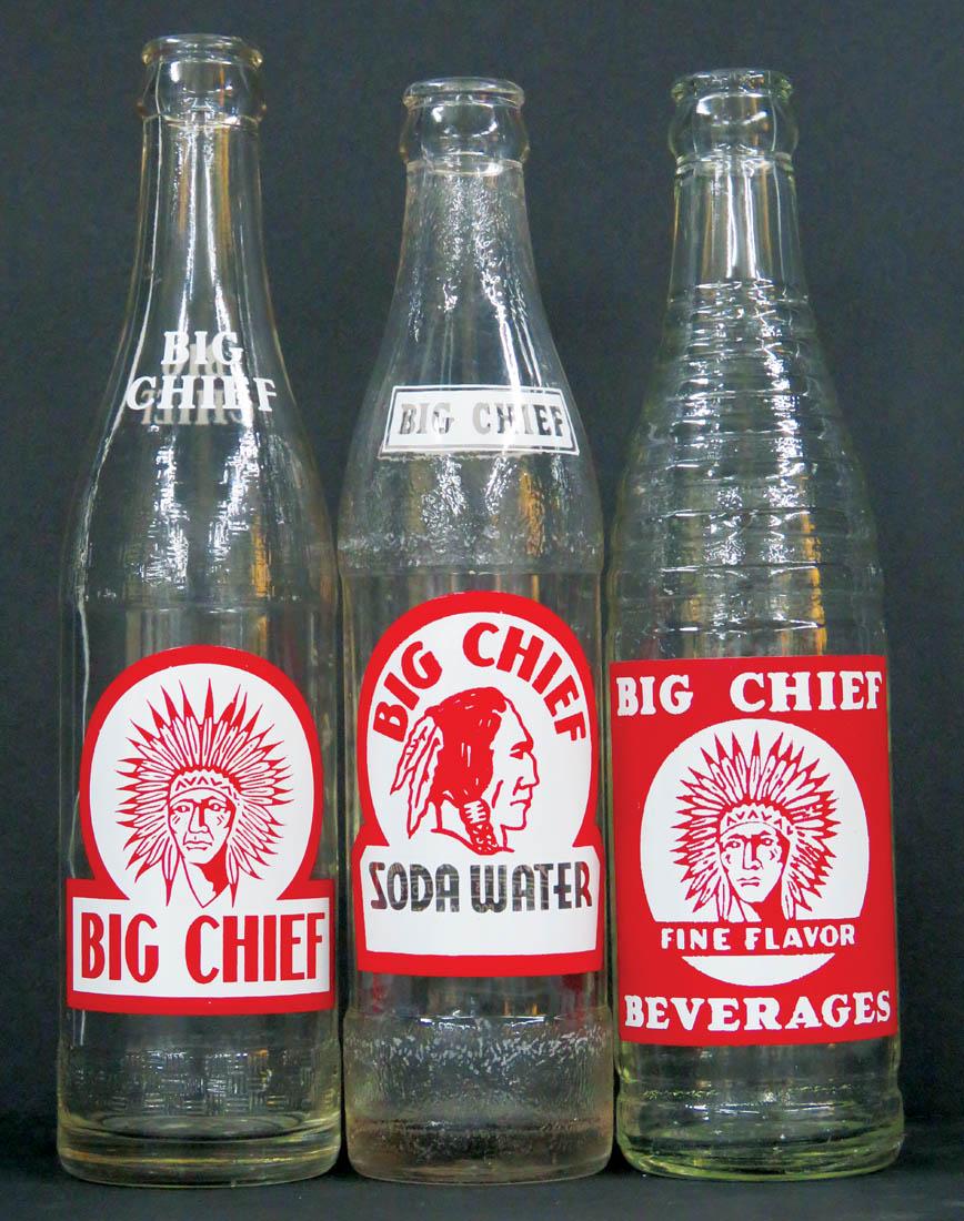 Three Coca Cola Big Chief Beverage Bottles: Three Coca Cola Big Chief Beverage Bottles. Embossed bottles with enamel labels including "Soda Water". No chips or cracks. 9 to 10 fluid ounces.