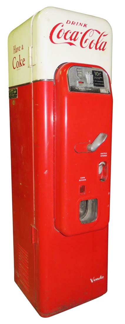 Coca Cola 10 Cent Vendo Machine: Coca Cola 10 Cent Vendo 44 Machine. Non-working condition, comes with keys. 58 inches tall.