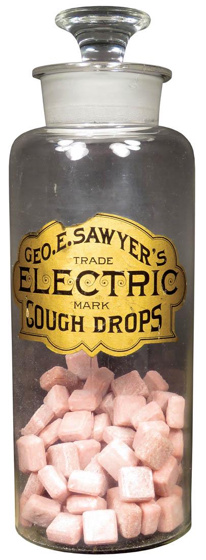 Geo. E. Sawyer's Electric Cough Drops Jar: Geo. E. Sawyer's Electric Cough Drops Apothecary Jar. Original paper label with ground glass stopper. No chips or cracks. 12 1/2 inches tall.