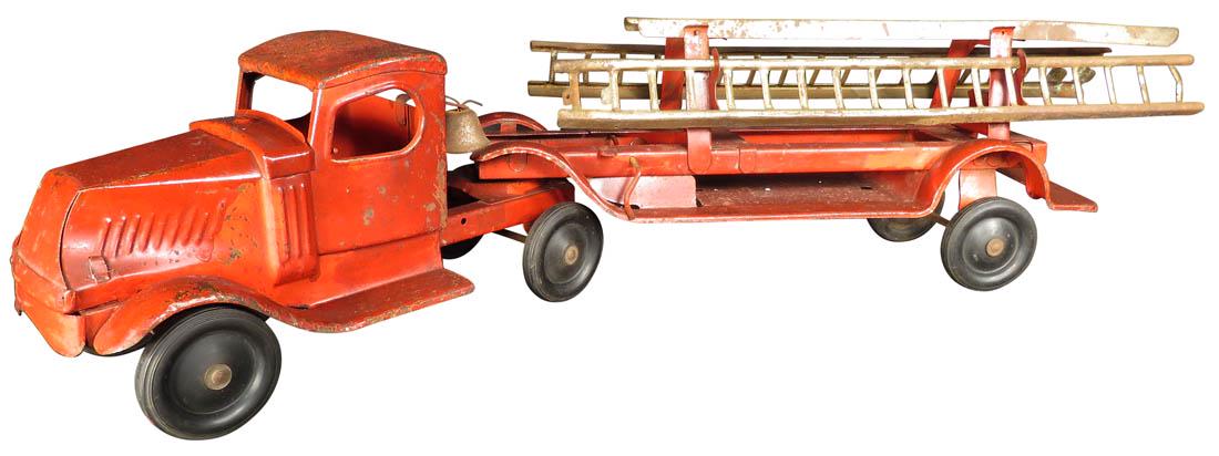 Mack Fire Ladder Toy Truck: Mack Fire Ladder Toy Truck. Comes with bell and three ladders. Played with condition.