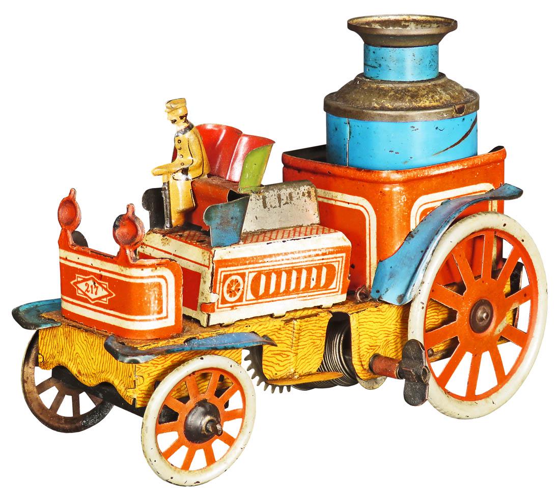 Tin Steamer Tin Wind Up Toy: Tin Steamer Tin Wind Up Toy. Driver is missing. Good working condition. 6 1/2 inches long.