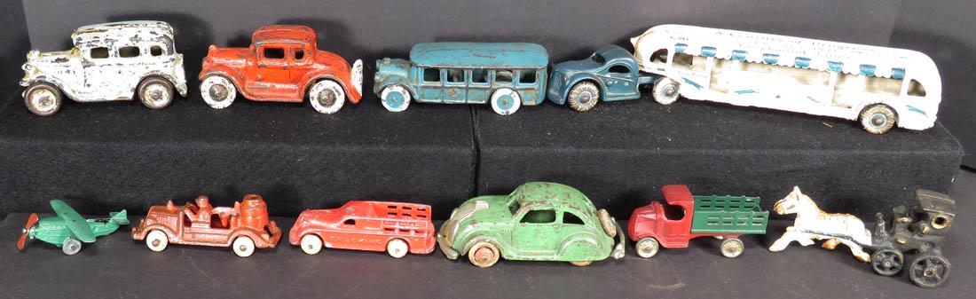 Collection of Ten Vintage Cast Iron and Die Cast Toys: Collection of Ten Vintage Cast Iron and Die Cast Toys including 1933 Arcade Greyhound Line Bus, 10 inches long.