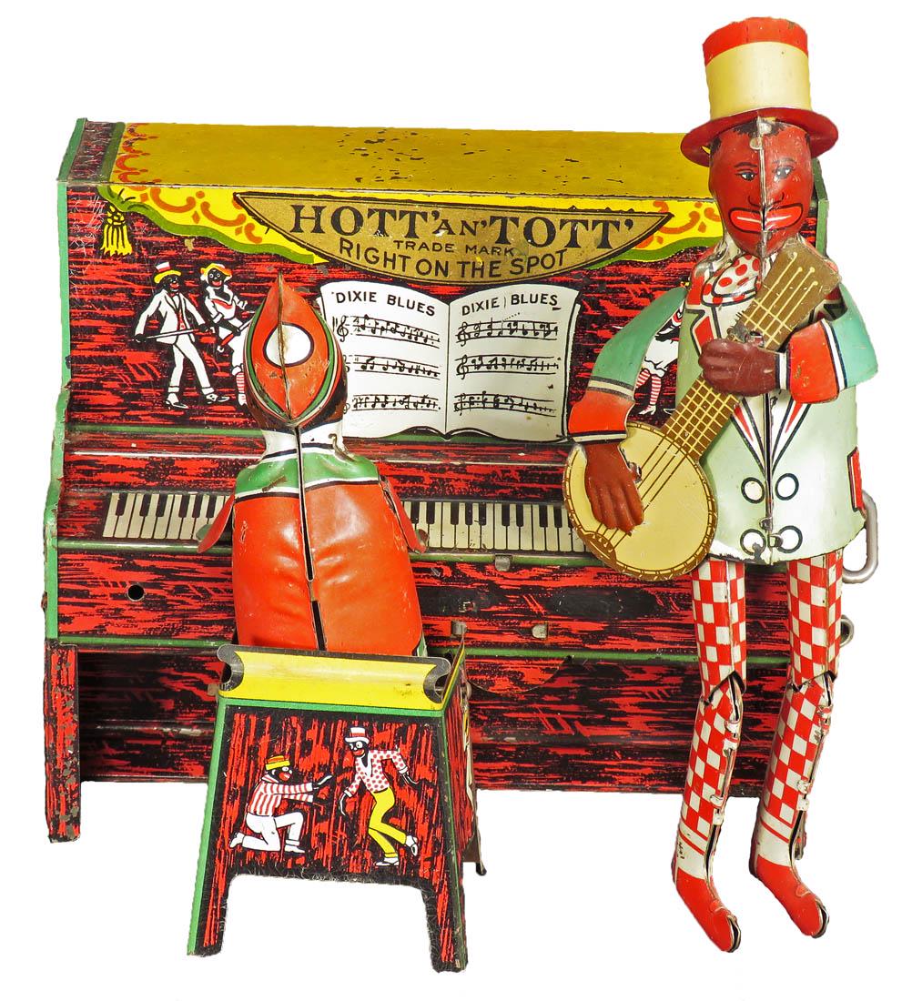 Unique Art Mfg. Co. Hott' an Tott" Tin Wind Up Toy: Unique Art Mfg. Co. Hott' an Tott" Character Tin Wind Up Toy, 1921. Complete but not working. Good original condition. 7 X 7 1/2 X 5 inches.