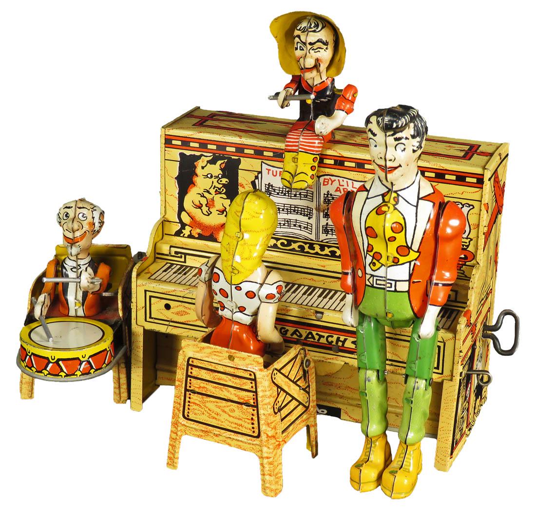 Unique Art Mfg. Co. L'll Abner Working Tin Toy: Unique Art Mfg. Co. L'll Abner Character Tin Wind Up Toy, ca. 1945. Complete. Good original working condition. 9 X 7 1/2 X 6 inches.