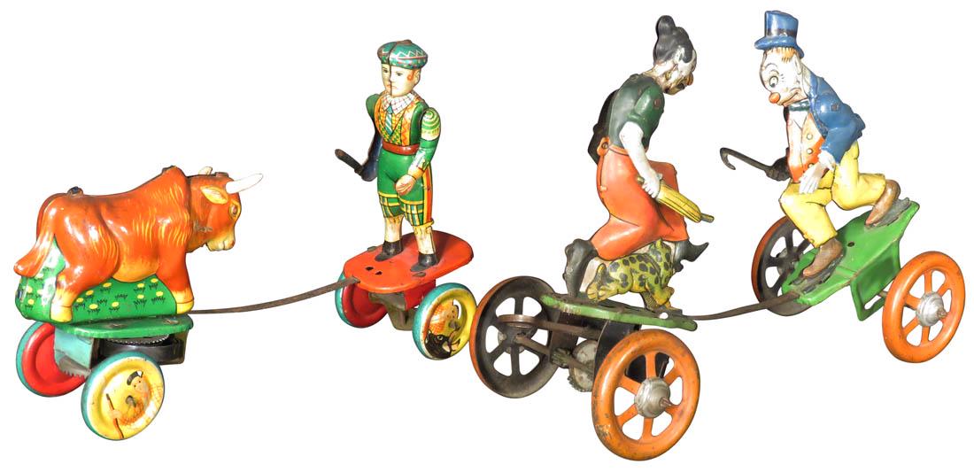 Two Vintage Tin Wind Up Toys: Two Vintage Tin Wind Up Toys. Maggie & Jiggs by Strauss, German 1924, working condition. Matador and Bull wind up Japan, 1960's, working condition.