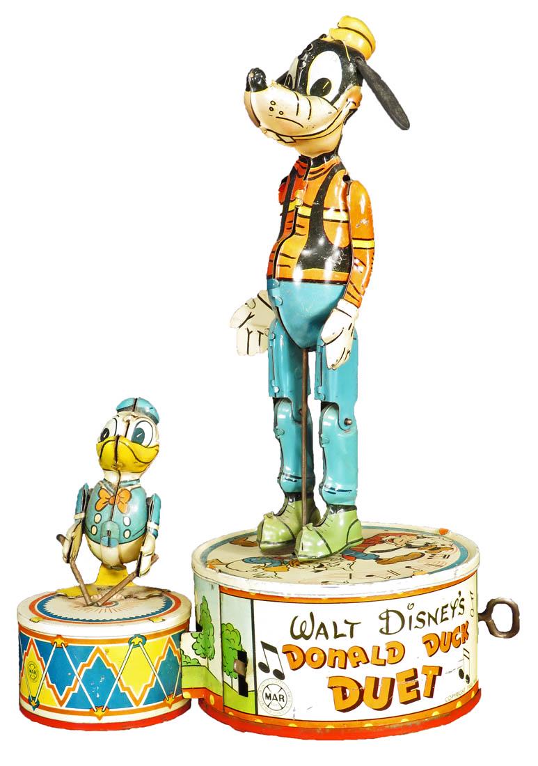 Louis Marx Vintage Walt Disney Duet Tin Toy: Louis Marx Vintage Walt Disney Donald Duck Duet Tin Wind Up Toy, 1947. Featuring Goofy and Donald Duck. Very good working condition. 10 inches tall.