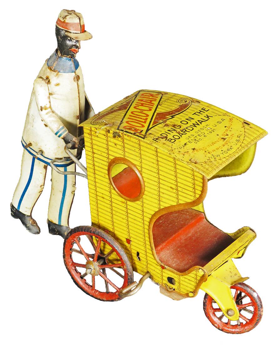 Ferdinand Strauss Rollo-Chair Tin Wind Up Toy: Ferdinand Strauss Rollo-Chair Tin Wind Up Toy, ca. 1921. Riding the Boardwalk. Good original working condition. 7 1/2 inches long.