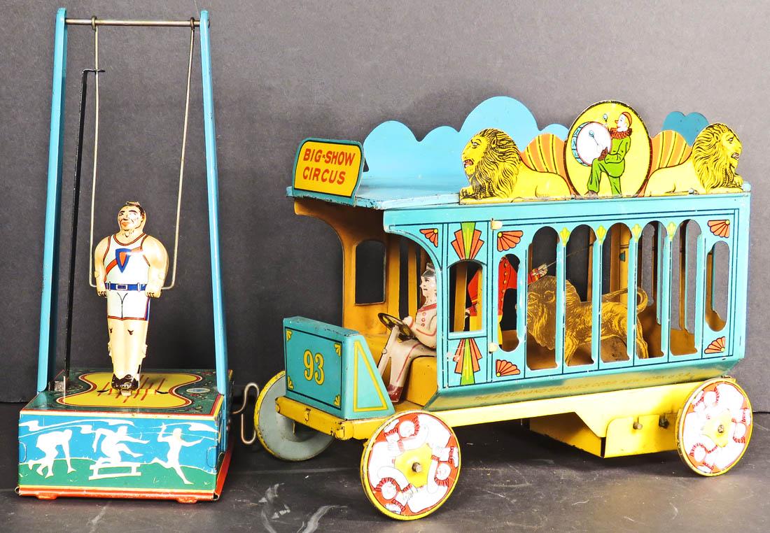Two Vintage Tin Wind Up Toys: Two Vintage Tin Wind Up Toys. Ferdinand Strauss Toy Circus Wagon, ca. 1920. Wyandotte Toys "Acrobat". Both in very good working condition. Wagon measures 9 inches long.