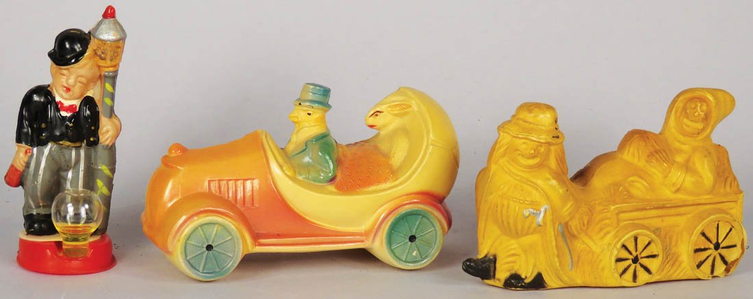 Collection of Three Vintage Celluloid Toys: Collection of Three Vintage Celluloid Toys. Man and lamp post barometer, Chicken chauffeuring a bunny and Halloween hay ride (cracks in bottom corners). Overall good condition. 3 3/4 inches long.