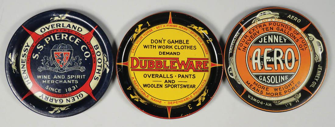 Three Tin Advertising Spinner Trays: Three Tin Advertising Spinner Trays. Used in saloons to spin for who pays. S.S. Pierce Co. Wine and Spirits Merchants. Jenney Aero Gasoline. Dubbleware Overalls, Pants and Woolen Sportswear. Minor edg