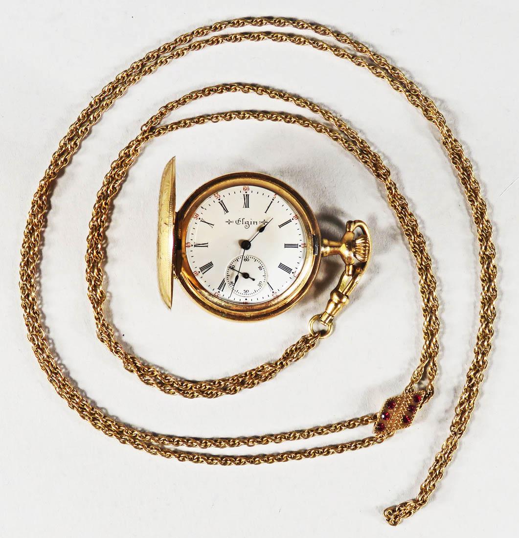 Elgin Pocket Watch: Elgin Pocket Watch, ca. 1903.7 jewels, 3/0 size. Gold filled beautifully engraved hunter case. Victorian watch chain with sliding diamond shaped ruby charm. Mech. 10979345.Case 8932148, Windsor, C.W.C