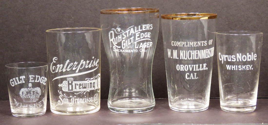 Five Early Etched Label Glasses: Five Early Etched Label Glasses. W.M, Kuchenmeister-Oroville, Calif. Ruhstaller's Gilt Edge Lager. Enterprise Brewing Co., Cyrus Nobel and Gilt Edge Whiskey shot glass. No chips or cracks. Tallest mea