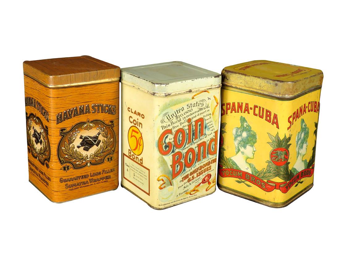Three 25 Count Cigar Tins: Three 25 Count Cigar Tins. Havana Sticks embossed tin by American Can Co. Coin Bond by the Buher & Bucher Co. Dayton. Spana-Cuba by Federal Can Co. Overall very good to good original condition. 3 1/4