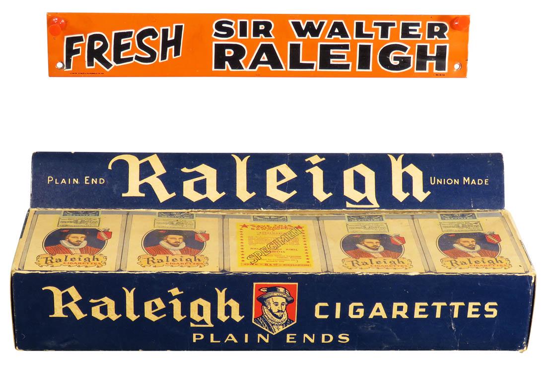 Raleigh Cigarettes Store Display and Tin Sign: Raleigh Cigarettes Cardboard Store Display and Tin Sign. Overall very good condition. Display measures 11 1/2 X 3 1/4 X 3 inches.