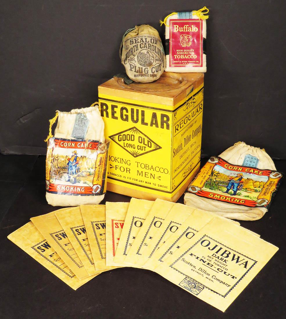 Collection of Tobacco Packs & Good Old Tobacco Box: Collection of Tobacco Packs and Good Old Tobacco Box. Corn Cake, Seal of North Carolina and Buffalo Smoking Tobacco Canvas Packs. (5) Ojibwa, (4) Sweet Mist Dark and Sweet Mist Bright paper packs. Tob
