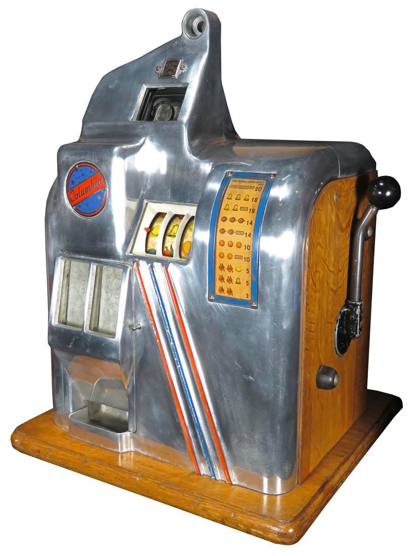 25 Cent Groetchen Columbia Deluxe Slot Machine: 25 Cent Groetchen Columbia Slot Machine, ca. 1938. Small countertop slot machine with three small reels and twin jackpot bank. Painted red/blue striping on aluminum. Working condition, comes with key.