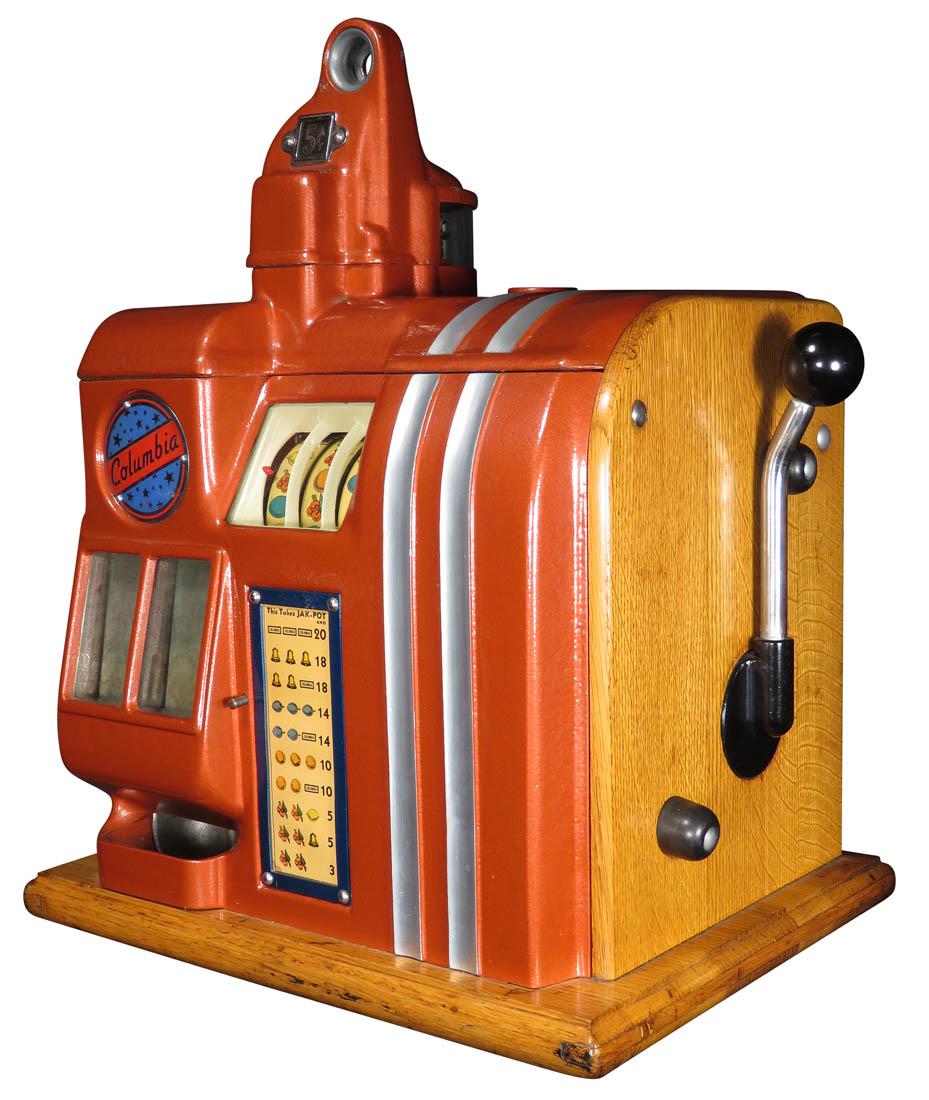 5 Cent Groetchen Columbia Slot Machine: 5 Cent Groetchen Columbia Slot Machine, ca. 1936. Small countertop slot machine with three small reels and twin jackpot bank. Painted metallic red top and face with silver striping. Working condition