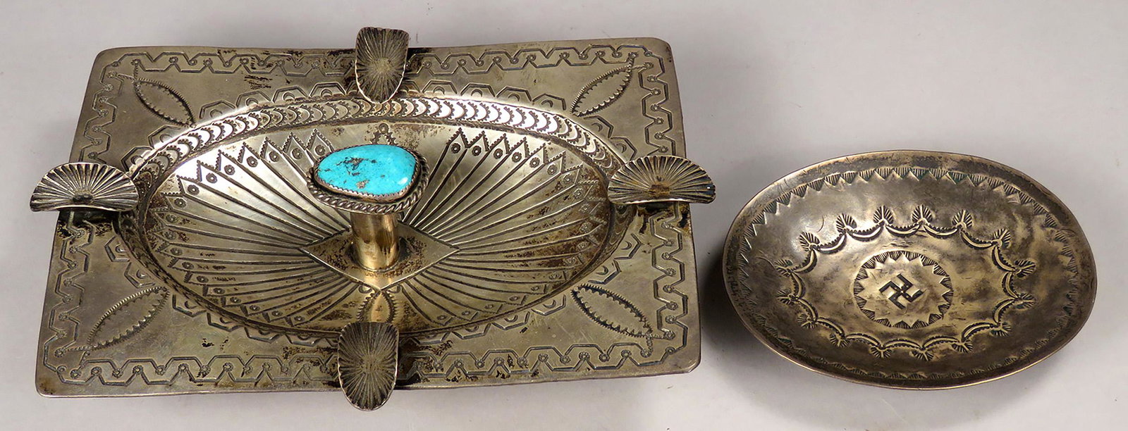 Native American Motif Silver Ashtray and Trinket Tray: Native American Motif, Silver Ashtray and Trinket Tray. Ashtray with turquois centerpiece, Stamped by Navajo artist Arnold Blackgoat. 6 X 4 1/4 inches. Navajo ca. 1915 trinket tray with hand stamped m