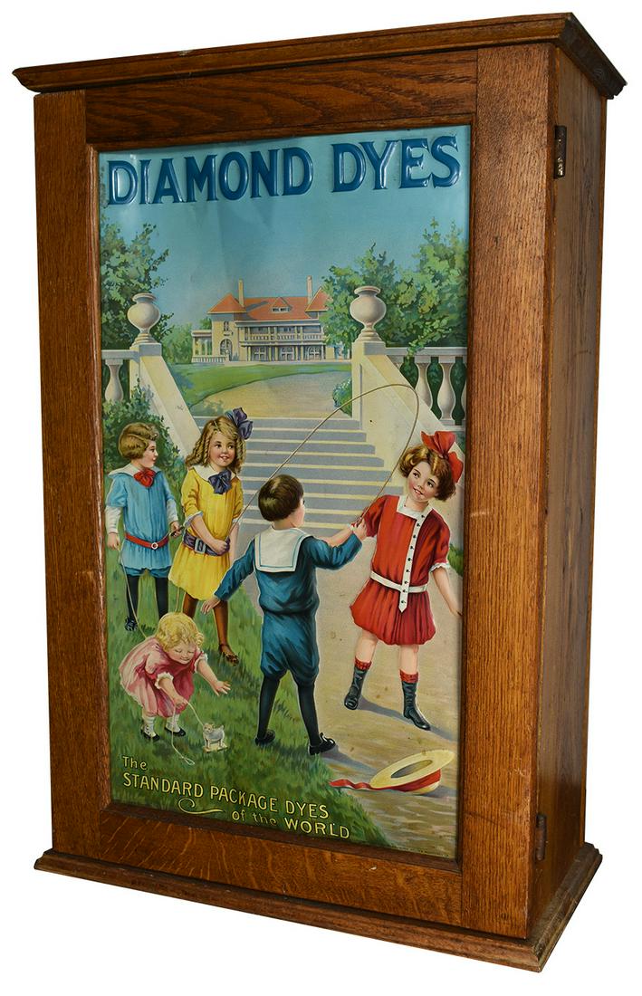 Diamond Dyes "Mansion" Tin Front Cabinet: Diamond Dyes "Mansion" Embossed Tin Front Cabinet. Good overall condition. 16 1/4 X 24 X 8 1/4 inches.