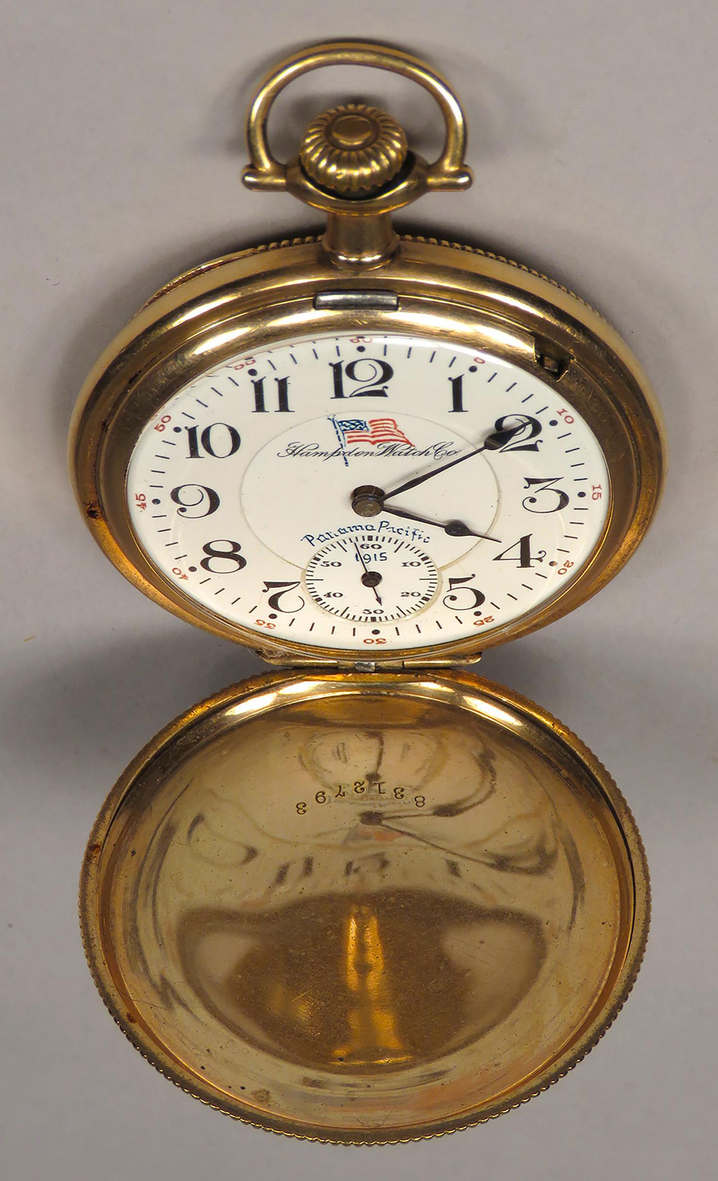 Hampden Watch Co. Pocket Watch that Runs: Hampden Watch Co. Pocket Watch. Panama Pacific 1915 Exposition. Beautifully engraved gold filled hunter case with American Flag on face. No. 105. 21 jewels, double roller-adjusted to 5 positions. Runs