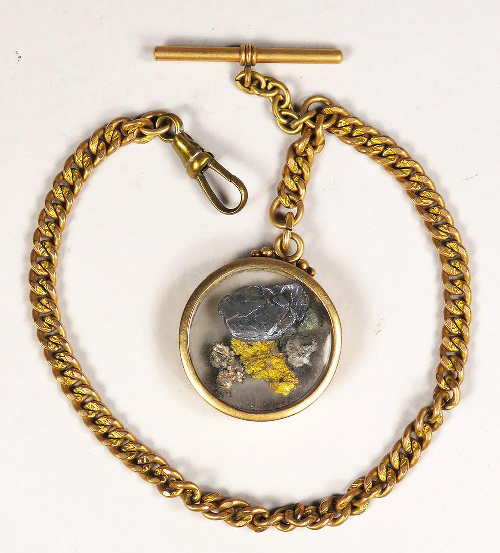 Antique Gold Ore Watch Fob and Chain: Antique, Gold Ore, Watch Fob and Chain. Pieces of gold ore in 1 1/4 inch clear locket fob. Chain measures 10 1/4 inches.