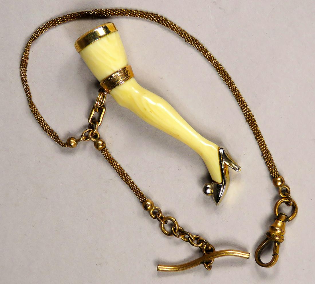Antique Ladies Leg Watch Fob and Chain: Antique, Ladies Leg Watch Fob and Chain. Leg made of bone with gold trim and delicate fine mesh chain. 8 inches long, leg measures 2 3/8 inches.