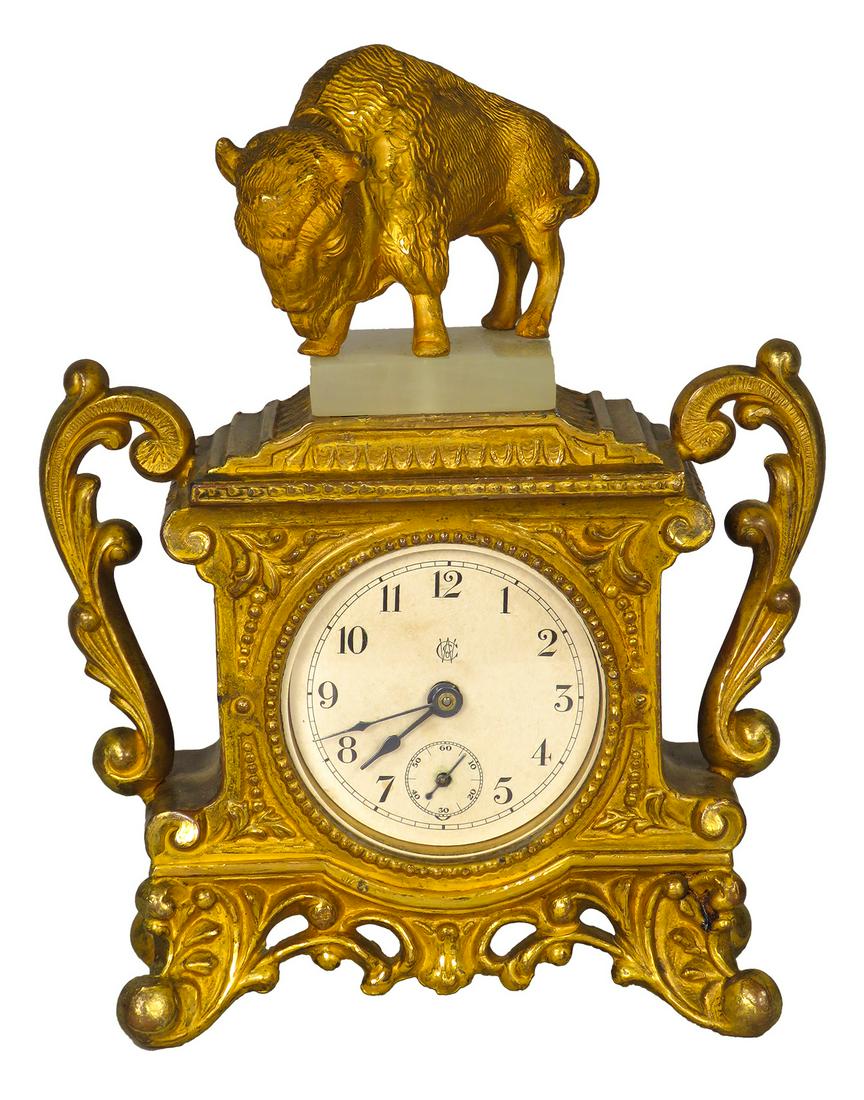 Antique W.C. Co. Shelf Clock: Antique, W.C. Co. Shelf Clock, last patent date 1891. Buffalo statue on top, gold wash base. Works. 4 1/2 X 6 X 2 inches.