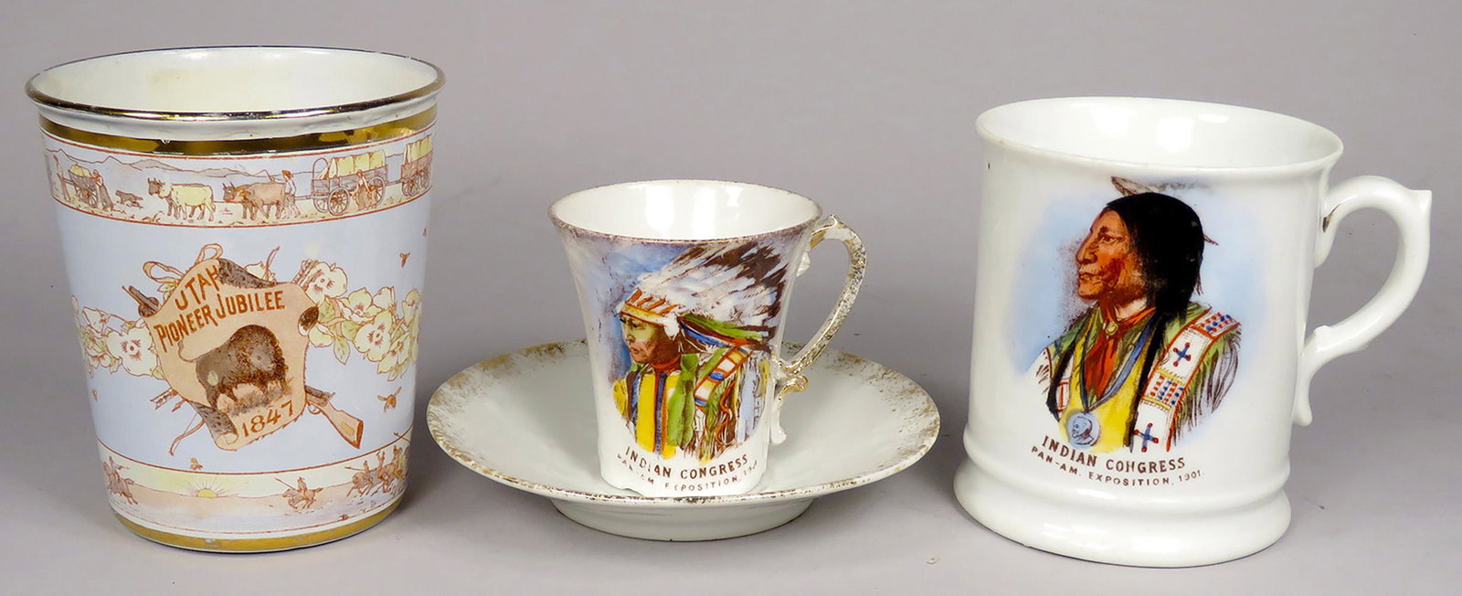 Two 1901 Pan America Exposition Souvenirs: Two 1901 Pan America Exposition Souvenirs and 1847 Utah Pioneer Jubilee Enamel Cup. Indian Congress Mug has small chip in lip near handle. Tea cup and saucer, stamped Austria.